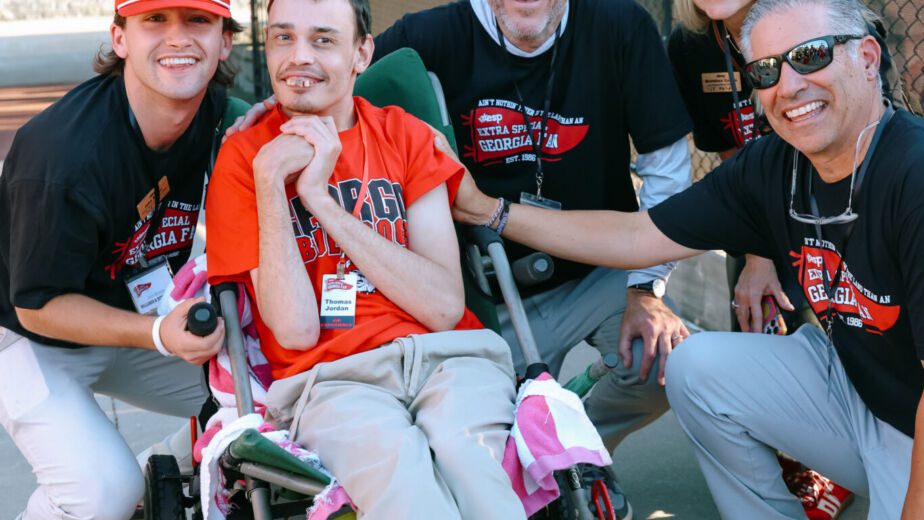 teen in wheelchair with friends at event
