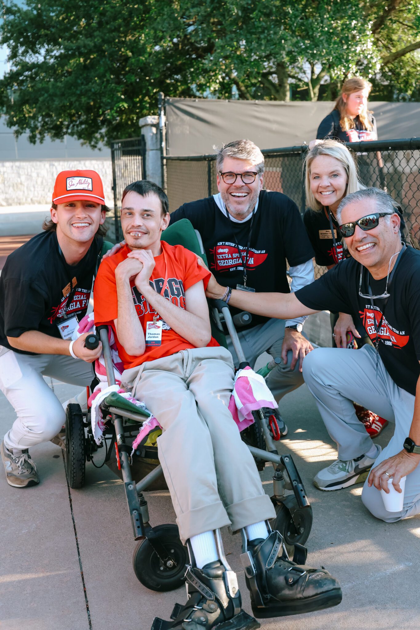 teen in wheelchair with friends at event