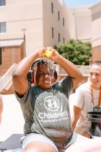 fun at summer camp - pouring eater on head