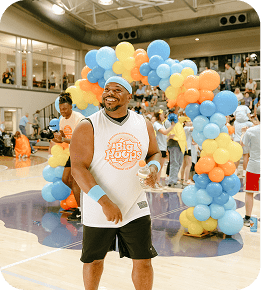 balloons and person on basketball floor