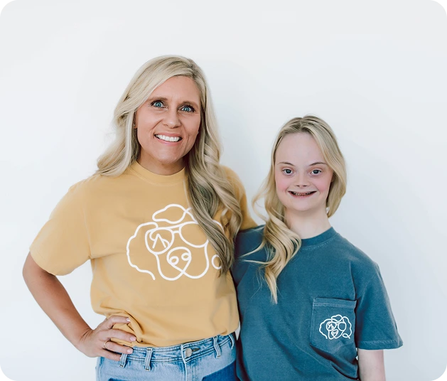 2 people wearing see ability shirts