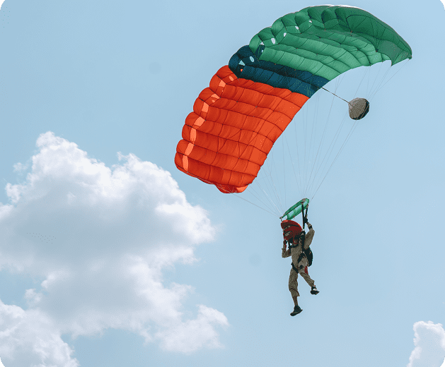 parachute man in dinosaur mask